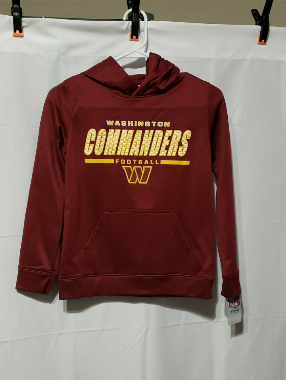 NFL Team Apparel Washington Commanders Youth Hooded Sweatshirt. Size: Medium